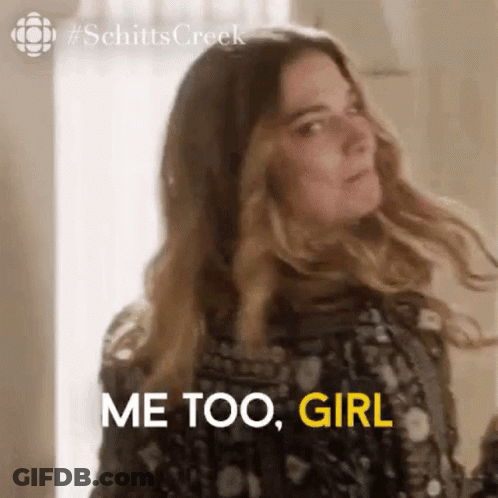 A Woman Is Standing In Front Of A Window With Her Hair Blowing In The Wind And Saying `` Me Too , Girl '' . GIF
