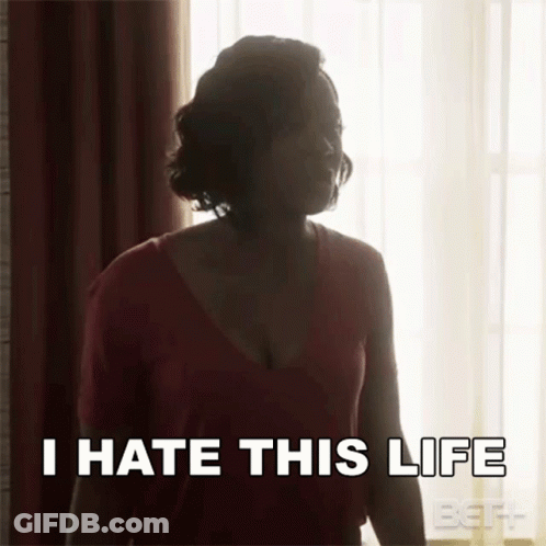 A Woman Is Standing In Front Of A Window With The Words `` I Hate This Life '' Written On Her Face . GIF