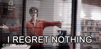 A Woman Is Standing In Front Of A Window With The Words " I Regret Nothing " Written Below Her GIF