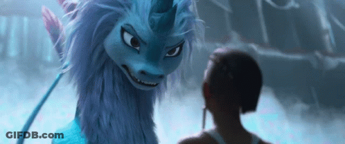 A Woman Is Standing Next To A Blue Dragon With A Unicorn Horn . GIF