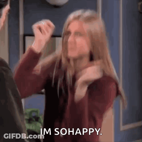 A Woman Is Standing Next To A Man And Making A Funny Face While Saying `` Im So Happy '' . GIF