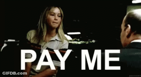 Woman Next To Man Holding Paper Says Pay Me GIF