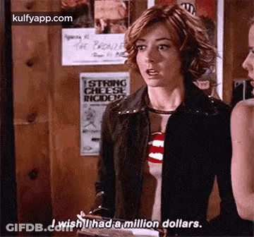 A Woman Is Standing Next To Another Woman In A Room And Talking To Her . GIF