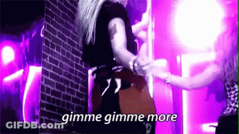 Woman Standing On Pole With Gimme Gimme More GIF