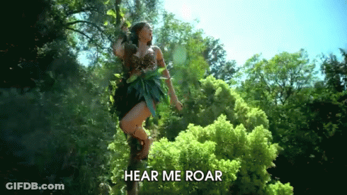 A Woman Is Standing On A Tree Branch With The Words Hear Me Roar Written Below Her GIF
