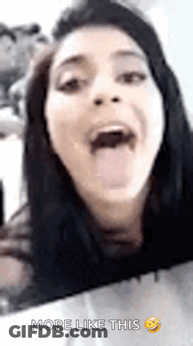 A Woman Is Sticking Her Tongue Out And Making A Funny Face With The Words More Like This Below Her GIF