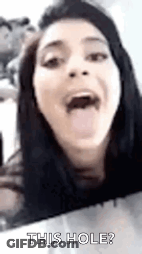A Woman Is Sticking Her Tongue Out And Saying `` This Hole ? '' GIF