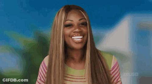 A Woman Is Sticking Her Tongue Out In Front Of A Blue Background GIF