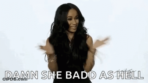 A Woman Is Sticking Her Tongue Out While Dancing And Making A Funny Face . GIF