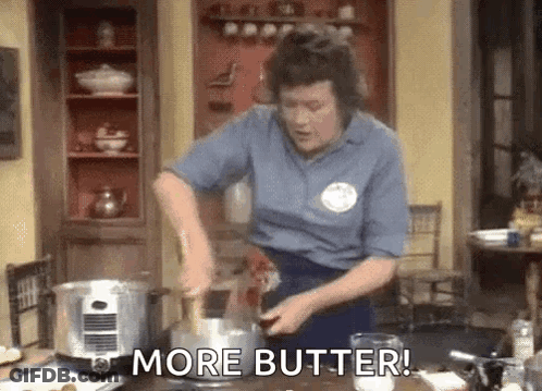 A Woman Is Stirring A Pot Of Food With A Wooden Spoon And Says `` More Butter ! '' GIF
