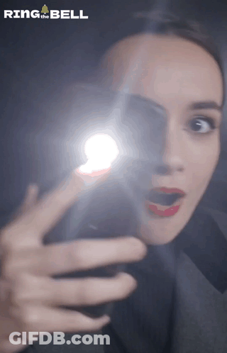 A Woman Is Taking A Picture Of Herself With Ring The Bell Written On The Bottom GIF