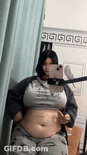 Woman Taking Mirror Selfie With Chinese Writing GIF