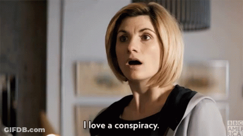 A Woman Is Talking About A Conspiracy And Making A Surprised Face . GIF