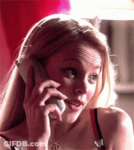 A Woman Is Talking On A Cell Phone And Making A Funny Face GIF