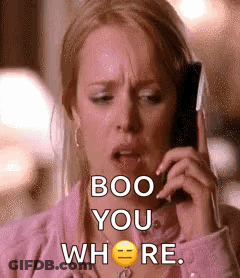 A Woman Is Talking On A Cell Phone And Says `` Boo You Where '' . GIF