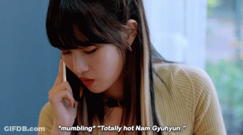 A Woman Is Talking On A Cell Phone And Says " Mumbling " GIF