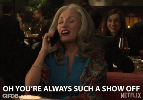A Woman Is Talking On A Cell Phone And Says Oh You 'Re Always Such A Show Off GIF