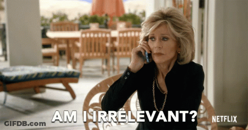 A Woman Is Talking On A Cell Phone And The Words Am I Irrelevant Are Above Her GIF