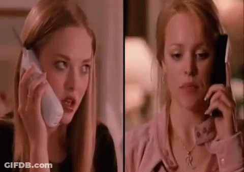 A Woman Is Talking On A Cell Phone Next To A Woman Talking On A Cell Phone . GIF