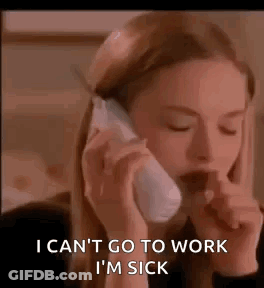 A Woman Is Talking On A Cell Phone While Coughing . GIF
