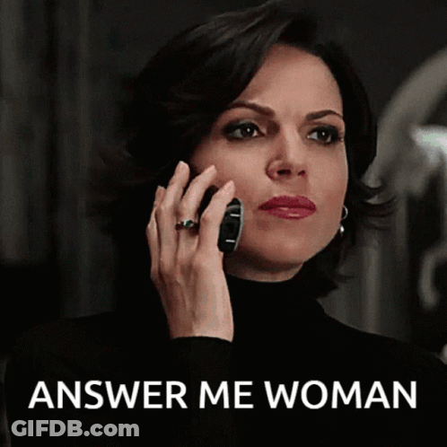 A Woman Is Talking On A Cell Phone With The Words Answer Me Woman Below Her GIF
