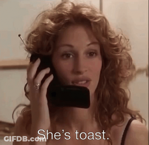 A Woman Is Talking On A Cell Phone With The Words She 'S Toast Written Below Her GIF
