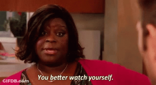 A Woman Is Talking To A Man And Saying `` You Better Watch Yourself . '' GIF