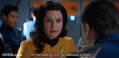 A Woman Is Talking To A Man And Says I 'M Not Letting Him Go Without A Fight GIF