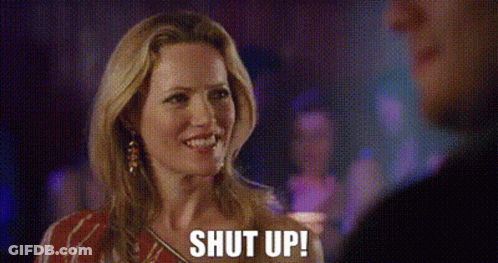 A Woman Is Talking To A Man At A Party And Says `` Shut Up '' . GIF