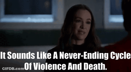 A Woman Is Talking To A Man In A Dark Room And Says It Sounds Like A Never-Ending Cycle Of Violence And Death GIF