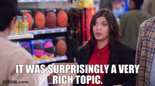 A Woman Is Talking To A Man In A Store And The Words `` It Was Surprisingly A Very Rich Topic '' Are Visible . GIF