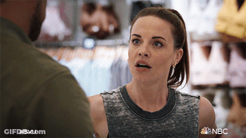 A Woman Is Talking To A Man In A Store With The Hashtag #Svu GIF