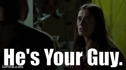 A Woman Is Talking To A Man With The Words He 'S Your Guy GIF