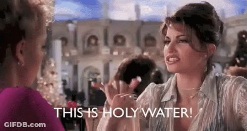 A Woman Is Talking To Another Woman And Says `` This Is Holy Water ! '' GIF