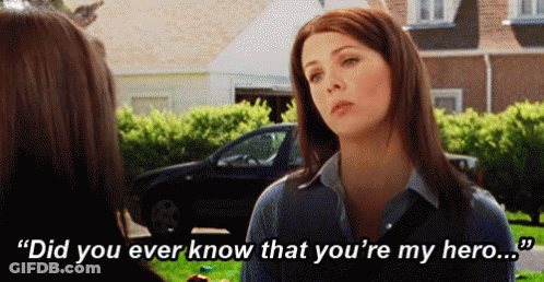 A Woman Is Talking To Another Woman In Front Of A Car And Says `` Did You Ever Know That You 'Re My Hero . '' GIF