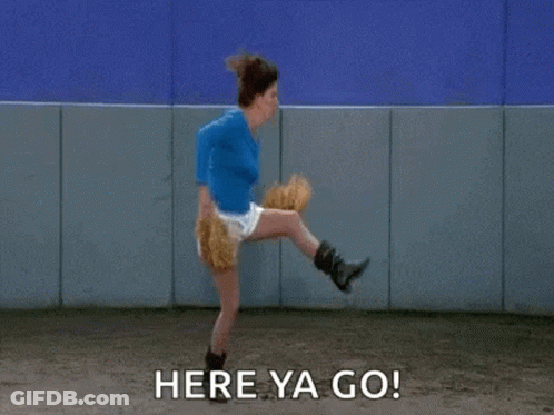 A Woman Is Throwing A Baseball With The Words `` Here Ya Go '' Written Next To Her . GIF