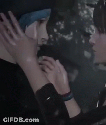 A Woman Is Touching A Man 'S Face With Her Hand . GIF