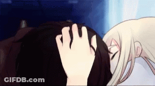 A Woman Is Touching A Man 'S Forehead With Her Hand . GIF