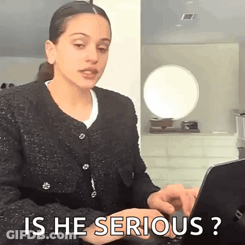 A Woman Is Typing On A Laptop Computer And Asking Is He Serious ? GIF