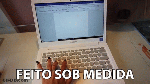 A Woman Is Typing On A White Samsung Laptop With The Words Feito Sob Medida Below It GIF