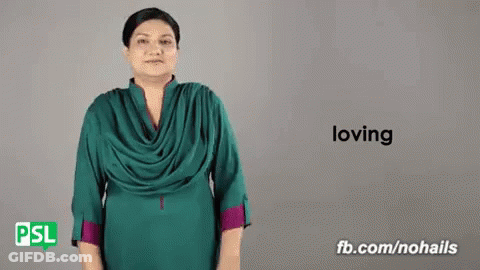 A Woman Is Using Sign Language To Say The Word Loving . GIF