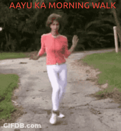 A Woman Is Walking Down A Road With The Words Aayu Ka Morning Walk Written Above Her GIF