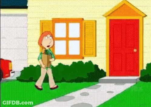 A Woman Is Walking Down A Sidewalk In Front Of A House . GIF