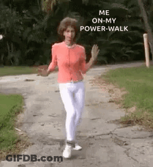 A Woman Is Walking Down A Sidewalk With The Words `` Me On My Power Walk '' Written On The Side Of Her Face . GIF