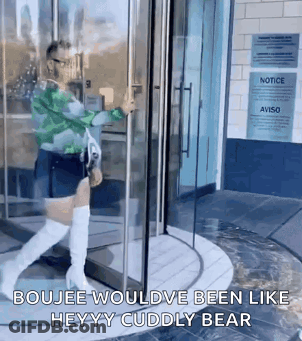 A Woman Is Walking Through A Glass Door With The Words Boujee Wouldve Been Like Heyy Cuddly Bear On The Bottom GIF