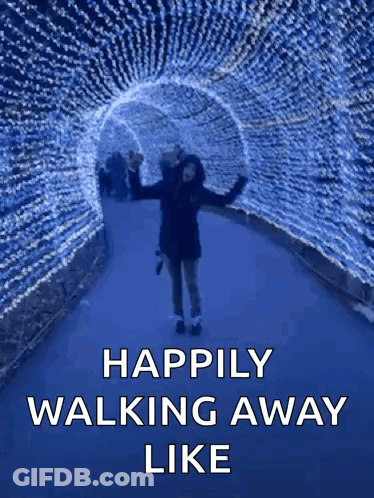A Woman Is Walking Through A Tunnel Of Lights With The Words " Happily Walking Away Like " GIF