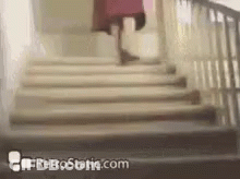 A Woman Is Walking Up A Set Of Stairs With Retrostatic.com Written On The Bottom . GIF