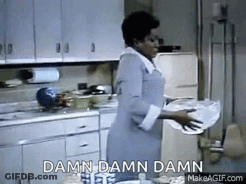A Woman Is Washing Dishes In A Kitchen And The Words `` Damn Damn Damn '' Are Visible . GIF