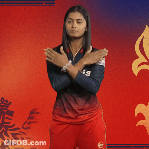 A Woman Is Wearing A Black And Red Kajaria Jersey GIF