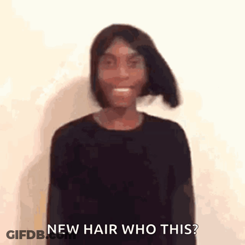 A Woman Is Wearing A Black Shirt And Smiling With The Words `` New Hair Who This ? '' Behind Her . GIF